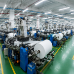 Modern bag manufacturing process scene inside an OEM production facility with machinery and quality-controlled workflow
